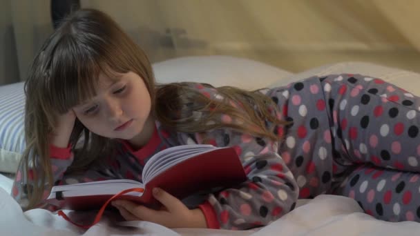 Child Little Girl Reading Books Lying Bed Home — Stockvideo