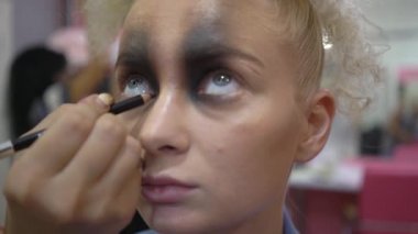 4k Professional Make-up artist doing glamour model makeup at work