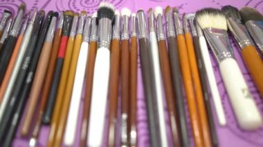 4k Set of cosmetic brushes on the table of makeup artist
