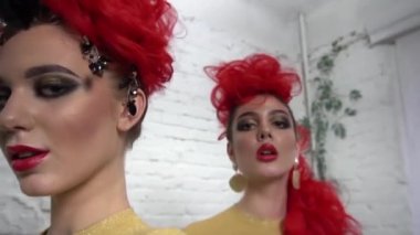 Creative make up. Close up portrait of girl with luxurious hairstyle