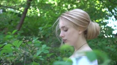 Young happy exited beautiful woman in garden. Bride.