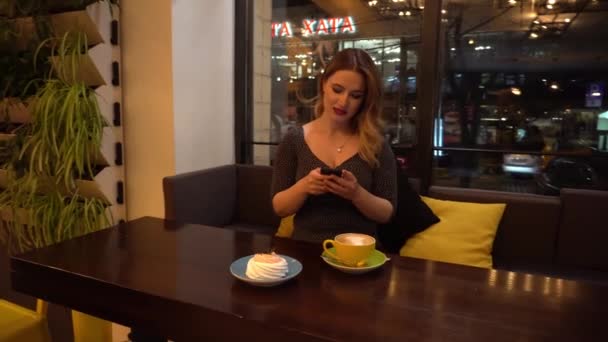 Woman Use Mobile Phone Coffee Shop Night — Stockvideo