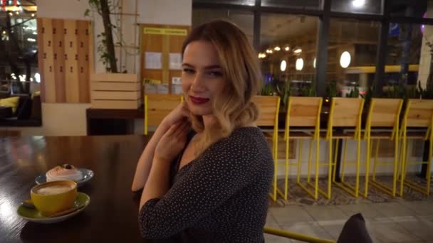 Chic Girl Sitting Restaurant Cup Coffee Evening — Vídeos de Stock