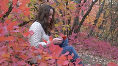 Slow Motion Girl with autumn leaves