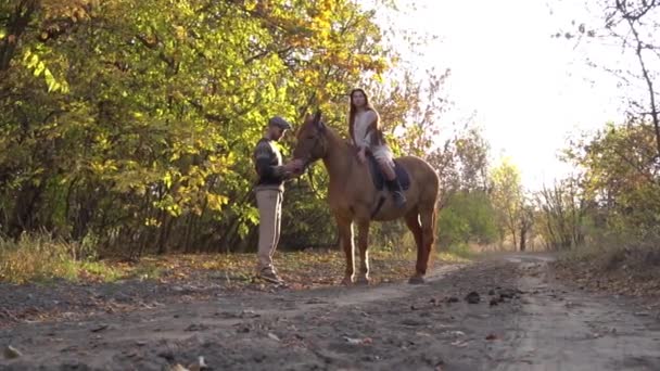 Slow Motion Young Couple Love Riding Horse — Wideo stockowe