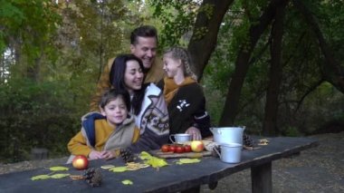 Family on vacation with fruits outdoor.