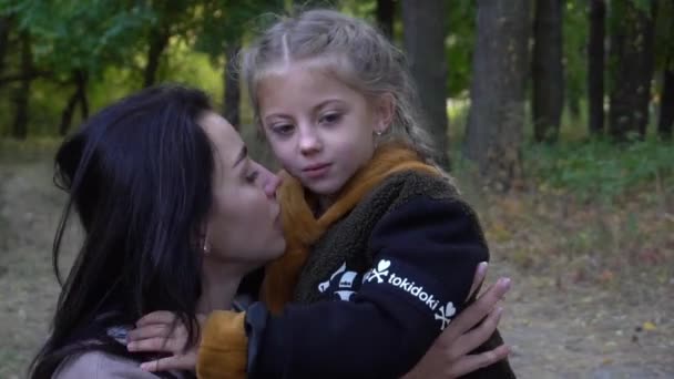 Close Portrait Embracing Mom Toddler Baby Daughter Autumn Park — Stockvideo