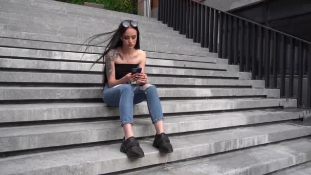 Young Woman Sitting City Stairs Using Phone — Stockvideo
