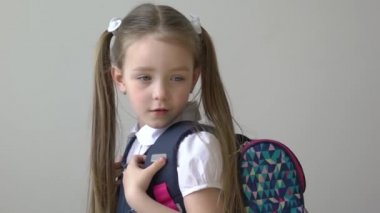 Slow Motion young happy smiling positive girl wear backpack go to school