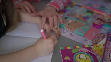 4k mother helping her daughter with homework