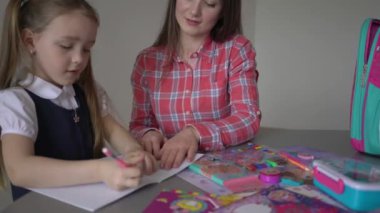 4k Mom helping kid with homework