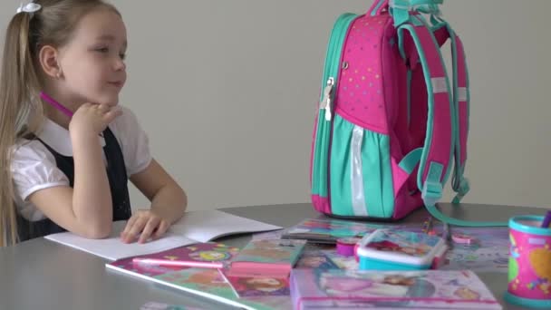 Caucasian Girl Sitting Desk Writing Notebook Doing Homework — Vídeo de Stock