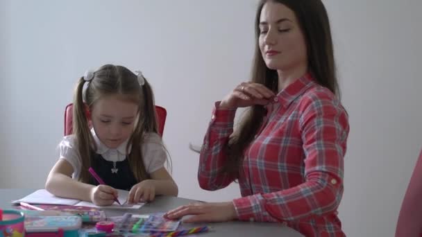 Slow Motion Girl Doing Homework Mother — Vídeos de Stock
