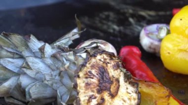 Spicy grilled chicken breast with vegetables and herbs on a roasting tin