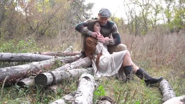 Slow Motion Young Couple Sitting Log Forest Embracing — Stockvideo