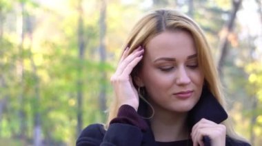 Slow Motion Autumn woman in autumn park. Warm sunny weather. Fall concept