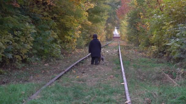 Slow Motion Boy Black Suit Walking Dog Bulldog Railway Autumn — Stockvideo
