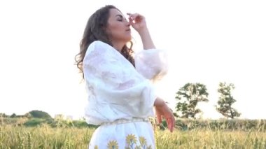 Summer Girl enjoying nature on yellow field