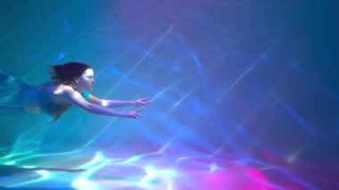 Slow Motion Girl in white dress underwater