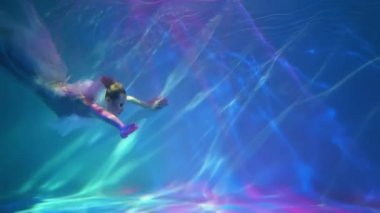 Slow Motion Women's health concept. Girl underwater in white.