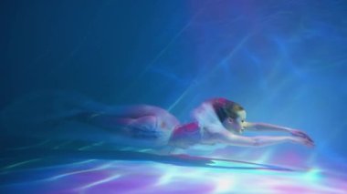 Slow Motion Girl in white dress underwater