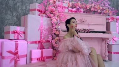 Slow Motion Portrait of young beautiful girl in long pink dress