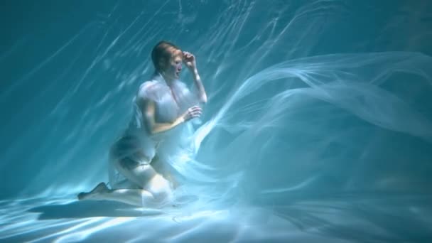 Girl Dress Swims Underwater Light Background Weightlessness — 图库视频影像