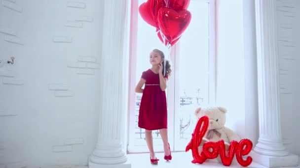 Slow Motion Little Girl Window Holding Balloon — Stockvideo