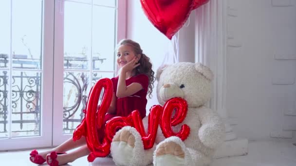 Girl Red Dress Holds Her Hands Inscription Love Balloons — Stock videók