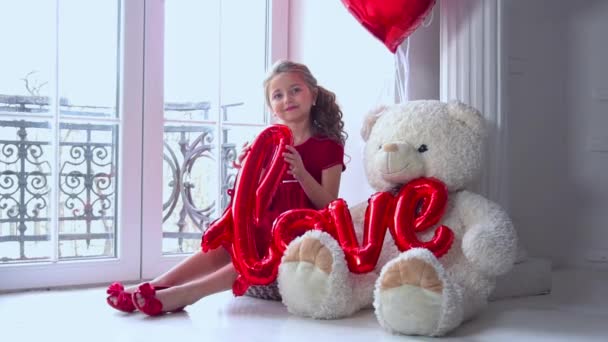 Slow Motion Little Girl Heart Shaped Balloon Window — Stockvideo