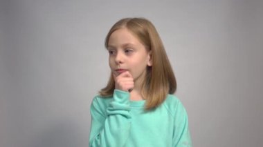 4k Thoughtful, thinking emotion concept. Beautiful child girl face portrait