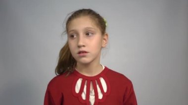 4k Beautiful positive girl look around over grey background
