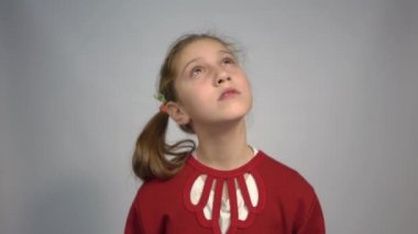 4k Portrait of the scared woman standing isolated on gray studio background