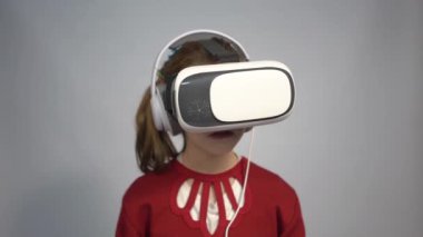 4k Young woman wearing virtual reality goggles vr box