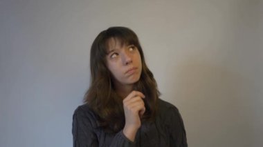 4k Girl thoughtful face make decision. Girl thinking