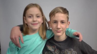 4k brother and sister together, hugging each other