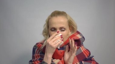 4k Portrait of sick blond woman suffering from runny nose and high temperature