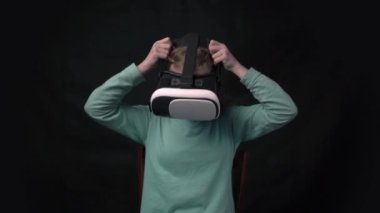 4k using VR headset. kid play video game. Digital future and innovation.