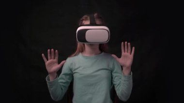 4k Adorable teenage girl using VR glasses