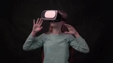 4k Young girl with virtual reality glasses. VR headset.