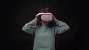 4k Child exploring digital virtual world with VR goggles.