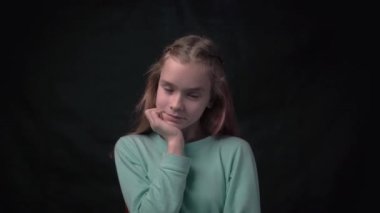 4k young attractive school girl happy positive smile think hand touch chin