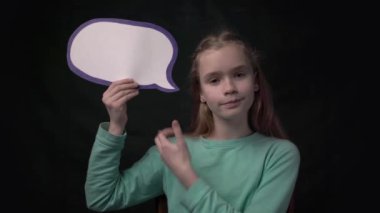 4k portrait of happy little girl holding a speech bubble