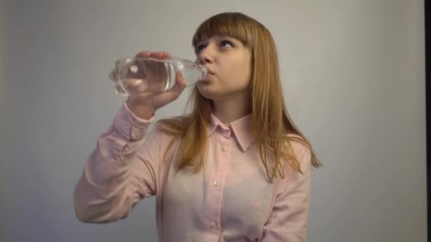 Young Woman Drinking Bottled Mineral Water — Stockvideo