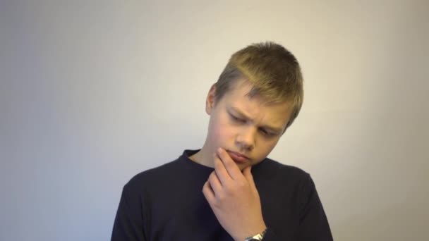 Attractive Teen Boy Tries Gather Thoughts Thinks Something — Stock Video