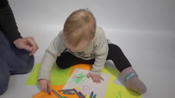 Happy Little Girl Sits Floor Draws Paper Colored Pencils — Vídeo de Stock