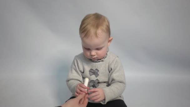 Close Portrait Little Girl Applying Hygienic Lipstick Balm Her Lips — Stok Video
