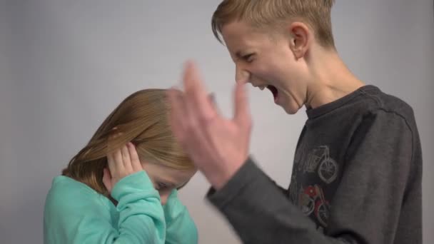 Emotional Portrait Brother Sister Teen Boy Shouting Little Girl — Stock Video