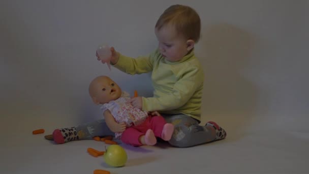 Slow Motion Beautiful Child Girl Playing Doll — Wideo stockowe