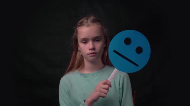 Girl Holds Hand Mask Emoticon Unhappy Embarrassing Face — Video